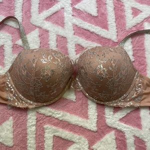 Victoria’s Secret pink/nude lace bra with jeweled straps.